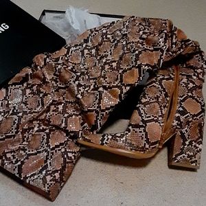 Thigh high snakeskin boots
